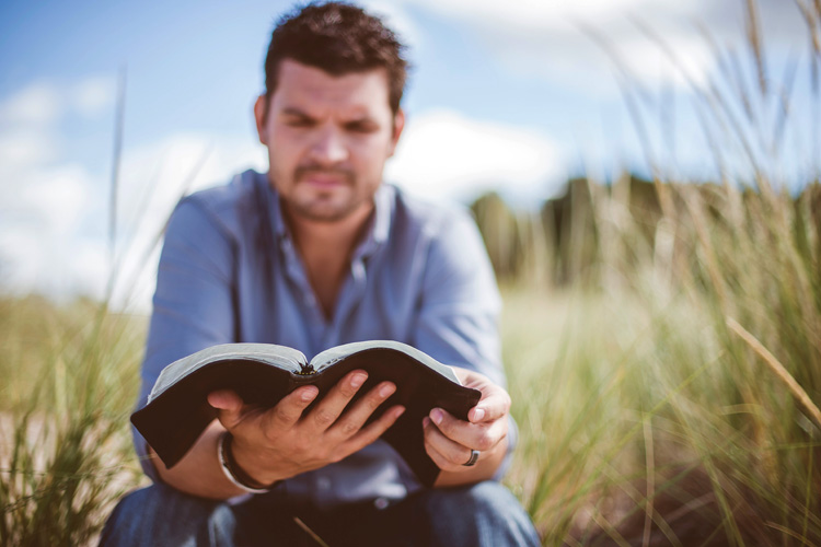 Man reading Bible - walking in subjection photo